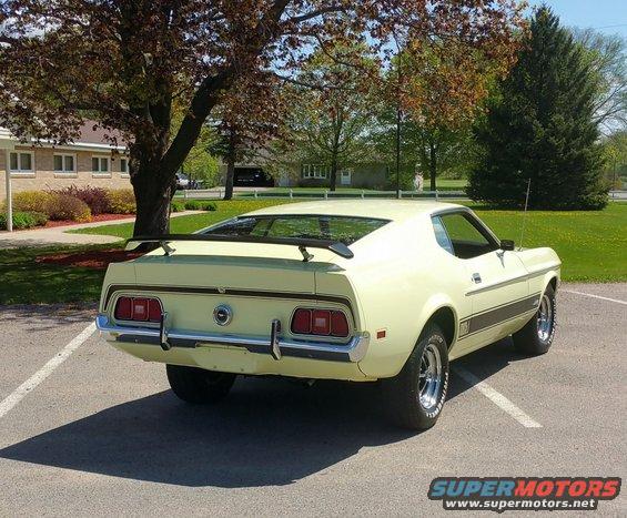 Yellow 1971 Ford Mustang Mach 1 rear view, parked in a lot