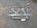 1989 Ford Bronco - This is a custom metal bracket, likely for a vehicle part, shown outdoors on a paved surface.