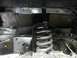 1989 Ford Bronco - Undercarriage view shows a suspension coil spring and painted frame components.