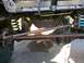 1989 Ford Bronco - Close-up view of the undercarriage, focusing on the suspension and differential components.
