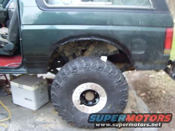 1989 Ford Bronco rear fender with large off-road tire mounted