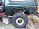 1989 Ford Bronco - Close-up of the rear fender and wheel well of a 1989 Ford Bronco.