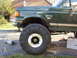 1989 Ford Bronco - This 1989 Ford Bronco features a lifted suspension and oversized off-road tires, indicating it's modified for terrain.
