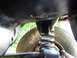 1989 Ford Bronco - Underside view of a vehicle's suspension system, showing a spring and tire. SuperMotors.net logo is present.
