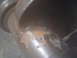 1989 Ford Bronco - A close-up view of a rusty exhaust pipe, showing signs of wear and tear.