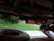 1989 Ford Bronco - Undercarriage view of a vehicle's exhaust system and a spare tire, with a visible Supermotors logo.