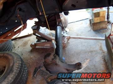 Undercarriage part with jack, SuperMotors logo visible