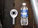 1989 Ford Bronco - A rod end bearing is shown next to a bottle of Crystal Spring Water for scale.