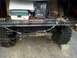 1989 Ford Bronco - Welding machine and fishing tackle box stored in the rear of a vehicle.