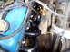 1989 Ford Bronco - Close-up view of an engine compartment, showing the valve cover and exhaust system.