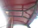1989 Ford Bronco - Metal roll cage structure visible inside a vehicle's cabin.