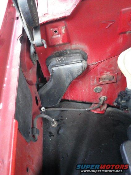 Red engine bay with black ducting and hoses
