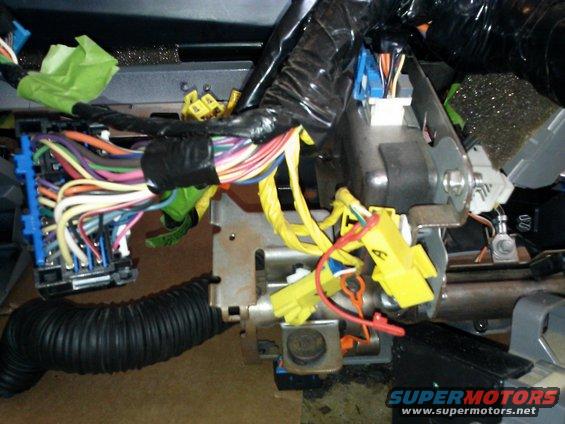 1998 Chevrolet C/K Pickup wiring harness with yellow and blue connectors, black conduit, and green tape