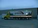 1999 Ford Crown Victoria - A yellow semi-truck with a white trailer is parked outside a building, displaying the "GROUNDCOVER SOLUTIONS" logo and imagery.