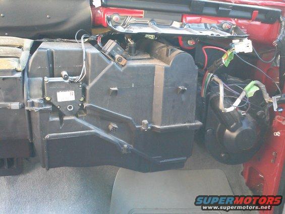 HVAC assembly and wiring in red vehicle interior