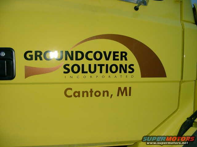 Yellow truck side with "GROUNDCOVER SOLUTIONS INCORPORATED" and "Canton, MI" text. Supermotors.net logo at bottom right