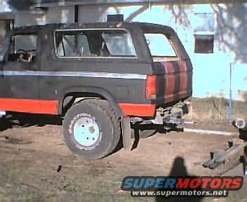 Black and red 1983 Ford Bronco rear view with aftermarket bumper