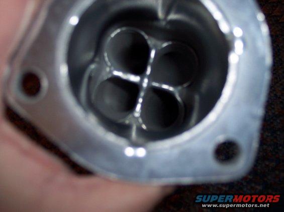 Close-up of intake manifold runner with four openings