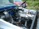 1978 Ford F-250 - The engine bay of a blue 1978 Ford F-250 shows the brake booster and master cylinder assembly.