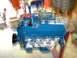 1978 Ford F-250 - Blue V8 engine with dual carburetors and red distributor cap, likely undergoing a rebuild.