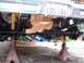 1978 Ford F-250 - The rear suspension and axle assembly of a truck are visible, supported by jack stands.
