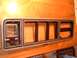 1978 Ford F-250 - Dashboard trim panel with faux woodgrain finish and multiple openings for gauges and vents.