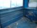 1978 Ford F-250 - The interior of a blue pickup truck bed shows ribbed paneling and a speaker grille, with a watermark at the bottom.