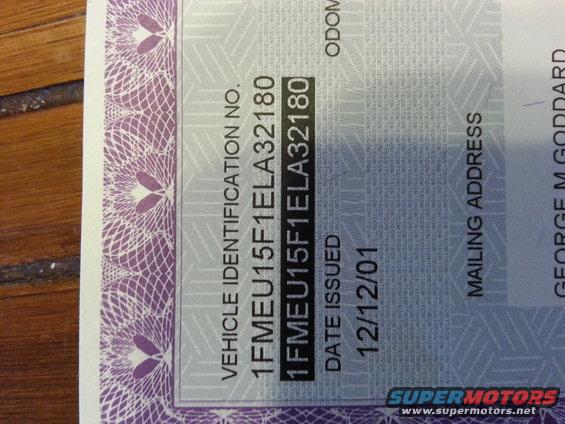 Vehicle registration document with VIN 1FMEU15F1ELA32180 and issue date 12/12/01