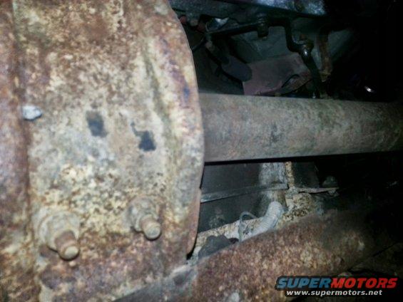 rusted exhaust pipe and differential housing with bolts