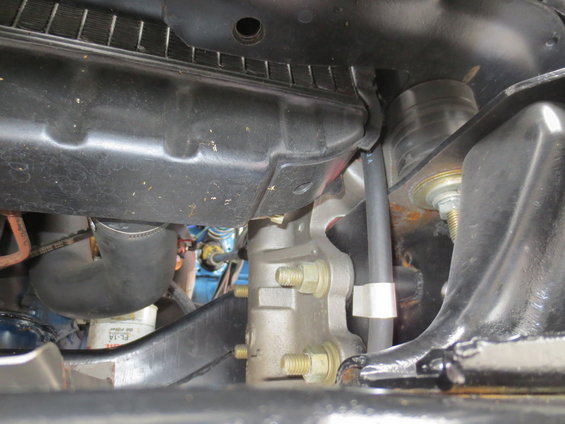1967 Ford F-250 engine bay with radiator and hoses