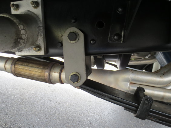 Truck leaf spring and exhaust system components, close-up