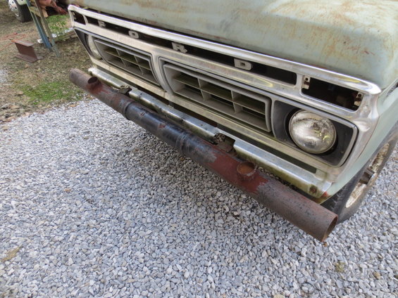 Light blue Ford truck front with chrome grille and custom pipe bumper. Grille indicates 1973 model year