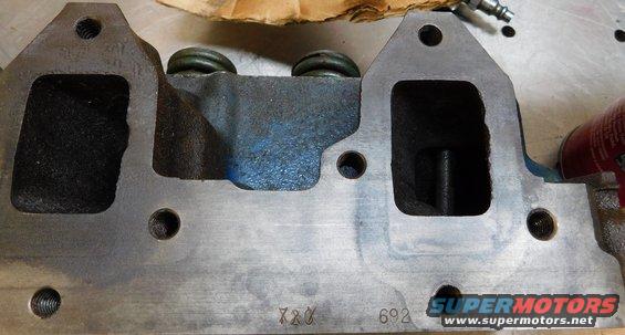 Engine cylinder head with visible numbers 720 and 692