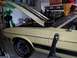 1971 Ford Mustang - This 1971 Ford Mustang Mach 1 is captured in a garage with its hood up, revealing racing stripes on the hood and body.
