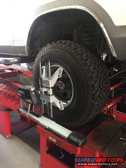 Wheel alignment equipment on a vehicle's front tire
