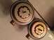 1967 Mercury Cougar - Close-up of two vacuum diaphragms, one marked Dole Valve Co. and the other with a Ford logo.