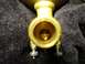 1967 Mercury Cougar - Close-up view of a brass valve component, showing its internal workings.