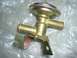 1967 Mercury Cougar - A brass heater control valve with a metal mounting bracket is shown against a plastic background.