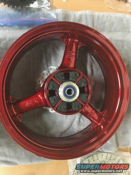 1998 ZX9R wheel lollypop red over super chrome base powder coat, new rotors, new bearings, new seals
