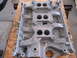 1963 Ford Galaxie - Close-up of an aluminum engine intake manifold, showing its ports and mounting surfaces.