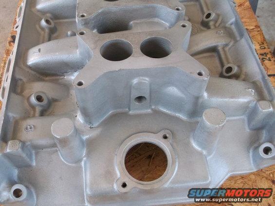 Aluminum intake manifold with dual carburetor mounting holes