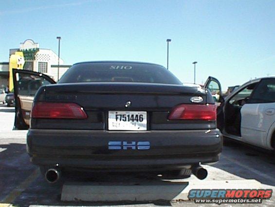 1999 Ford Taurus SHO rear view with license plate F751446 and dual exhaust pipes