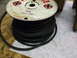 1963 Ford Galaxie - A spool of black hose with manufacturing details visible on the label.