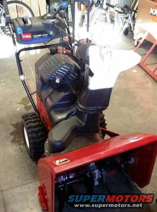 Toro Power Max snow blower with red housing and black engine