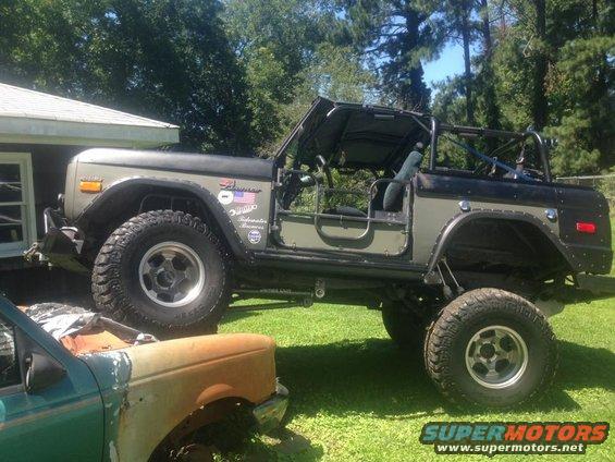 1972 Ford Bronco, 3q-front view, olive green and black with off-road tires