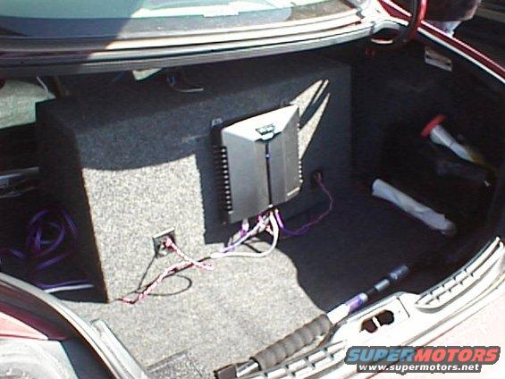 Trunk with subwoofer box and amplifier, wires connected