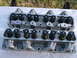 1963 Ford Galaxie - Two aluminum engine cylinder heads are shown, each with multiple valve springs and retainers, laid out on a flat surface.