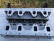 1963 Ford Galaxie - Close-up of an engine cylinder head showing valve springs and ports.