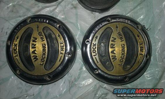 Two Warn locking hubs with "LOCK" and "FREE" settings