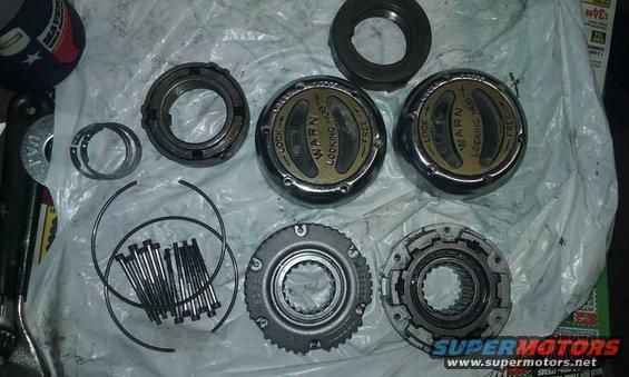 Warn locking hubs and associated parts laid out on a surface